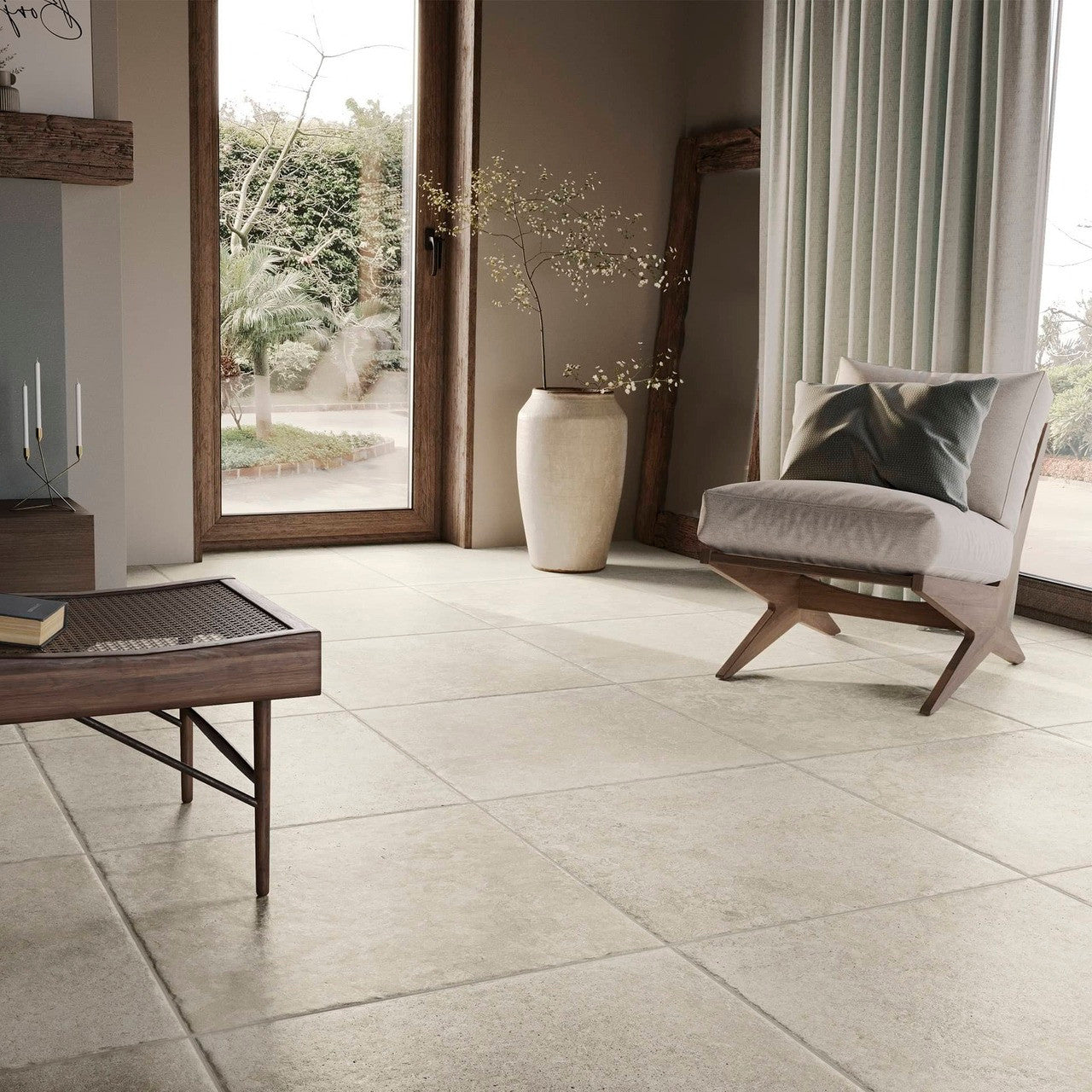 Showcasing the tile's elegant stone-effect finish in a cosy interior space with natural light and wooden accents.