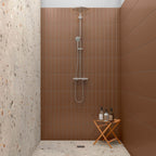 Shower wall lined with Serene Brown Matt Metro Tiles arranged vertically, creating a spa-inspired look.