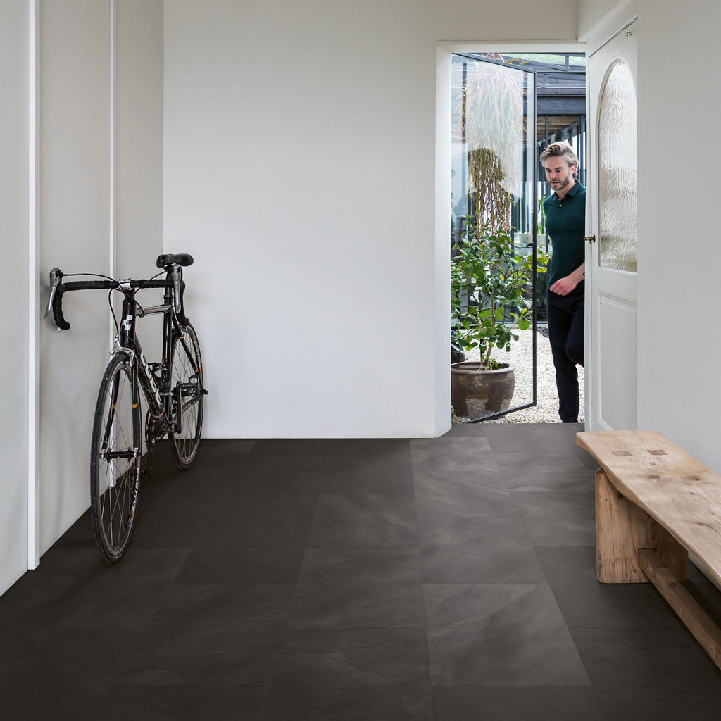 Quick‑Step Muse Black Slate MUS5492 8mm Laminate Flooring (MUS5492) - Premium Quick-Step collection featuring black luxury vinyl tile flooring with waterproof technology and easy click-fit installation