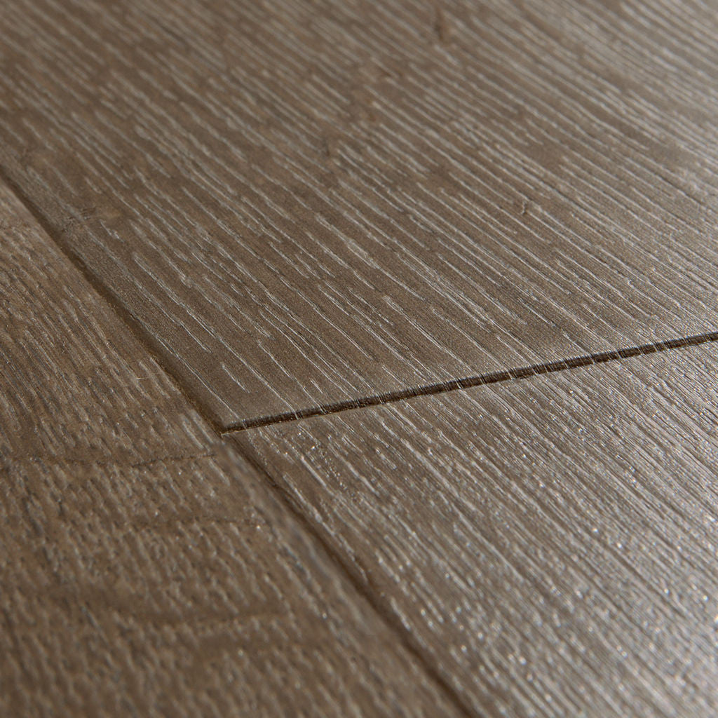 Quick‑Step Impressive Classic Oak Brown 8mm Laminate Flooring (IM1849) - Premium Impressive collection featuring oak luxury vinyl tile flooring with waterproof technology and easy click-fit installation