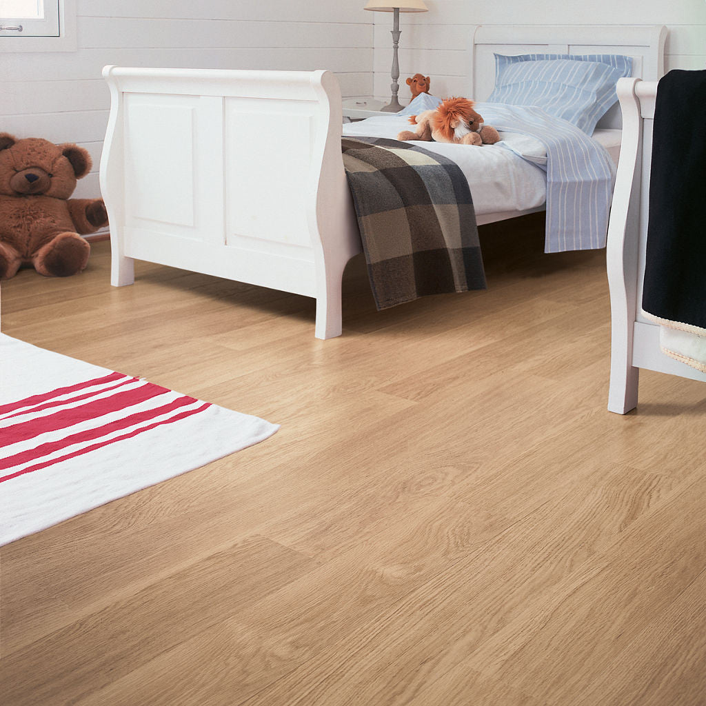 Quick-Step Eligna White Varnished Oak in a bedroom setting