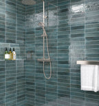 Contemporary bathroom featuring Urban Blue Glossy Metro Wall Tiles in a vertical stack layout, showcasing their deep blue tones and high-gloss finish.