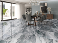 Valencia Aqua Supershine Porcelain Tile 60x120cm featured in modern dining space, with flowing grey and aqua marble-effect pattern.