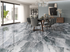 Valencia Aqua Supershine Porcelain Tile 60x120cm featured in modern dining space, with flowing grey and aqua marble-effect pattern.