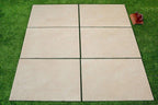 Close-up of beige hammered porcelain paving slab surface texture 900x600mm