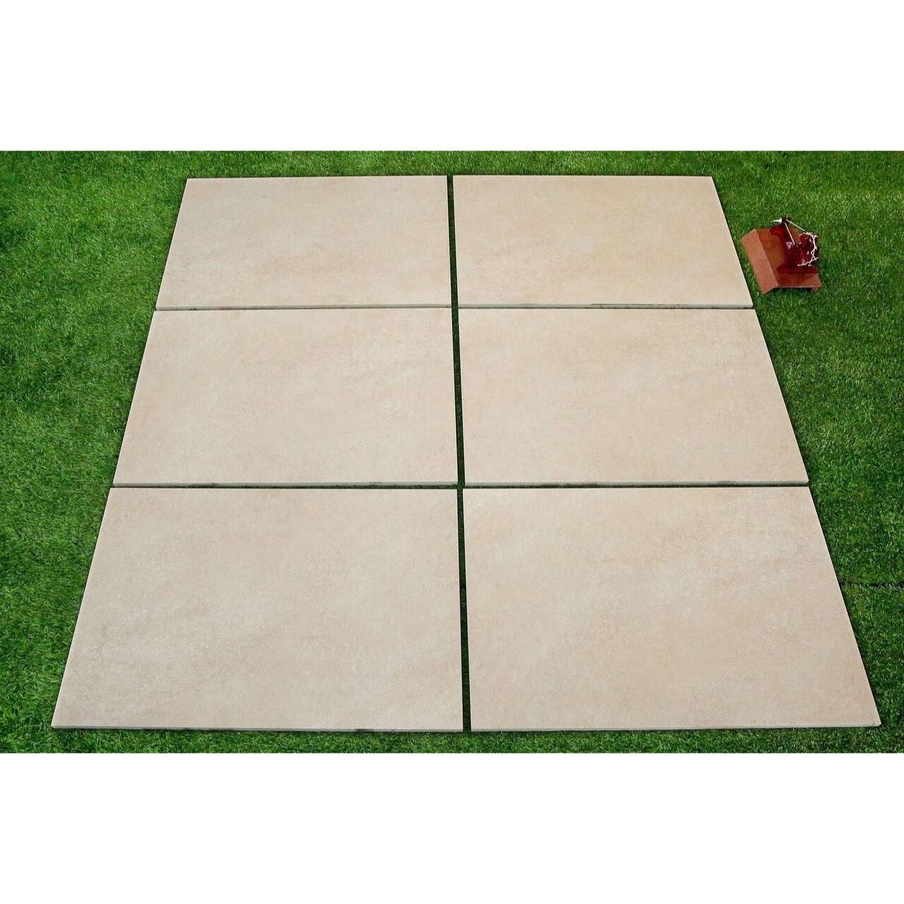 Close-up of beige hammered porcelain paving slab surface texture 900x600mm