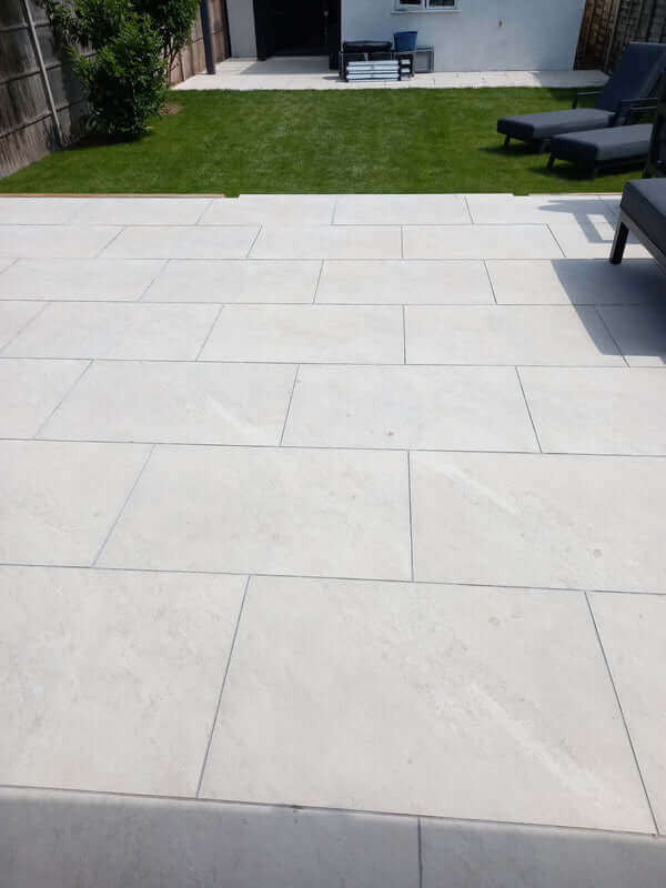 Yorkstone white porcelain garden slabs 900x600mm in landscaped garden