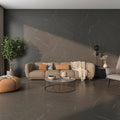 Zena Grey Matt Tile styled in a modern living room with neutral furnishings and warm lighting.